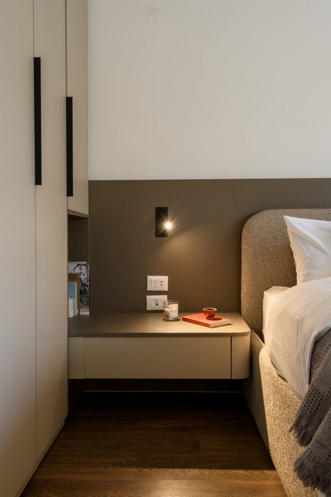 Close-up of bedroom details in the Mivida residence highlighting textures and material finishes
