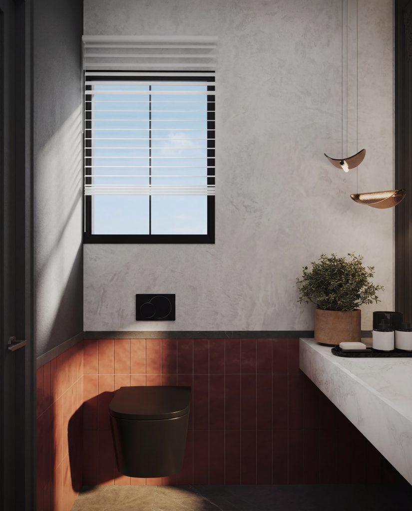 Modern guest bathroom with matte black wall-mounted toilet, terracotta red subway tile wainscoting, textured grey plaster walls, and copper pendant lighting