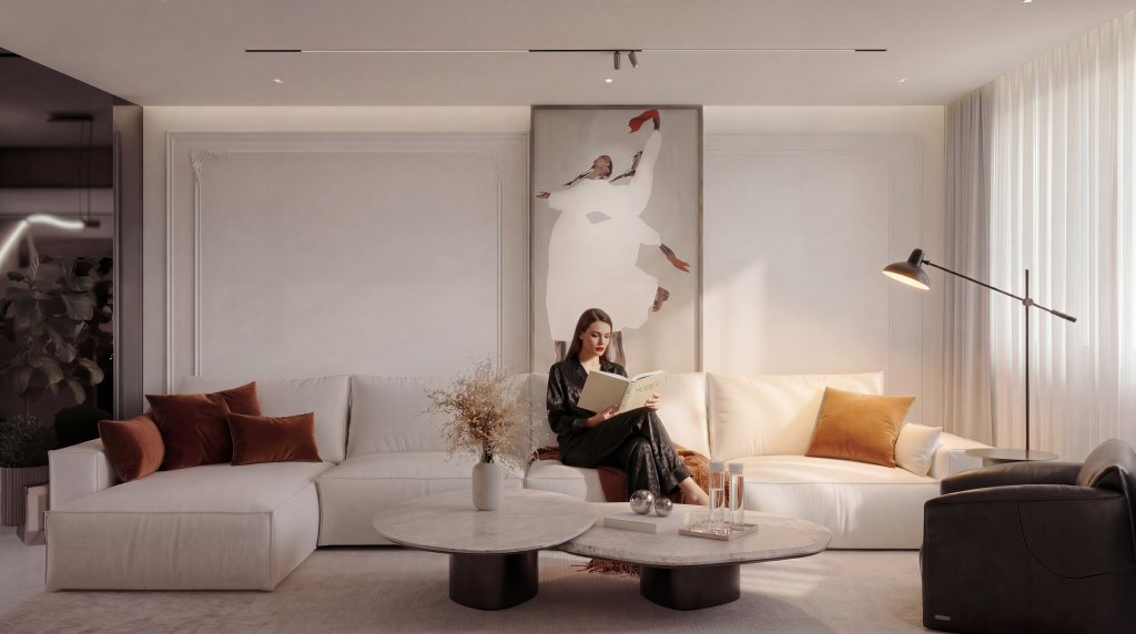 Elegant reception living room with oversized cream modular sofa, rust velvet throw pillows, paired oval marble coffee tables, tall abstract figurative wall art, and black floor lamp